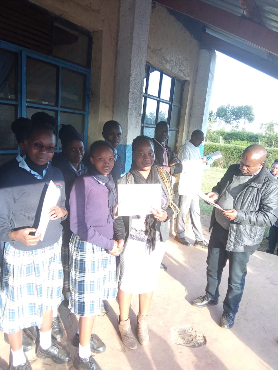 music department heads and students receiving certificates from the principal