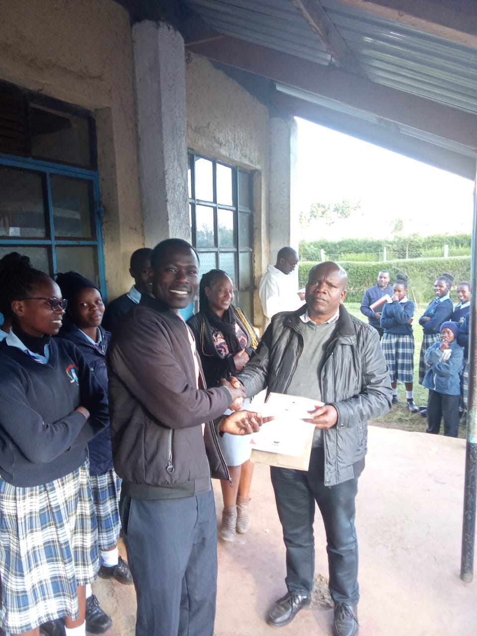 music department heads and students receiving certificates from the principal