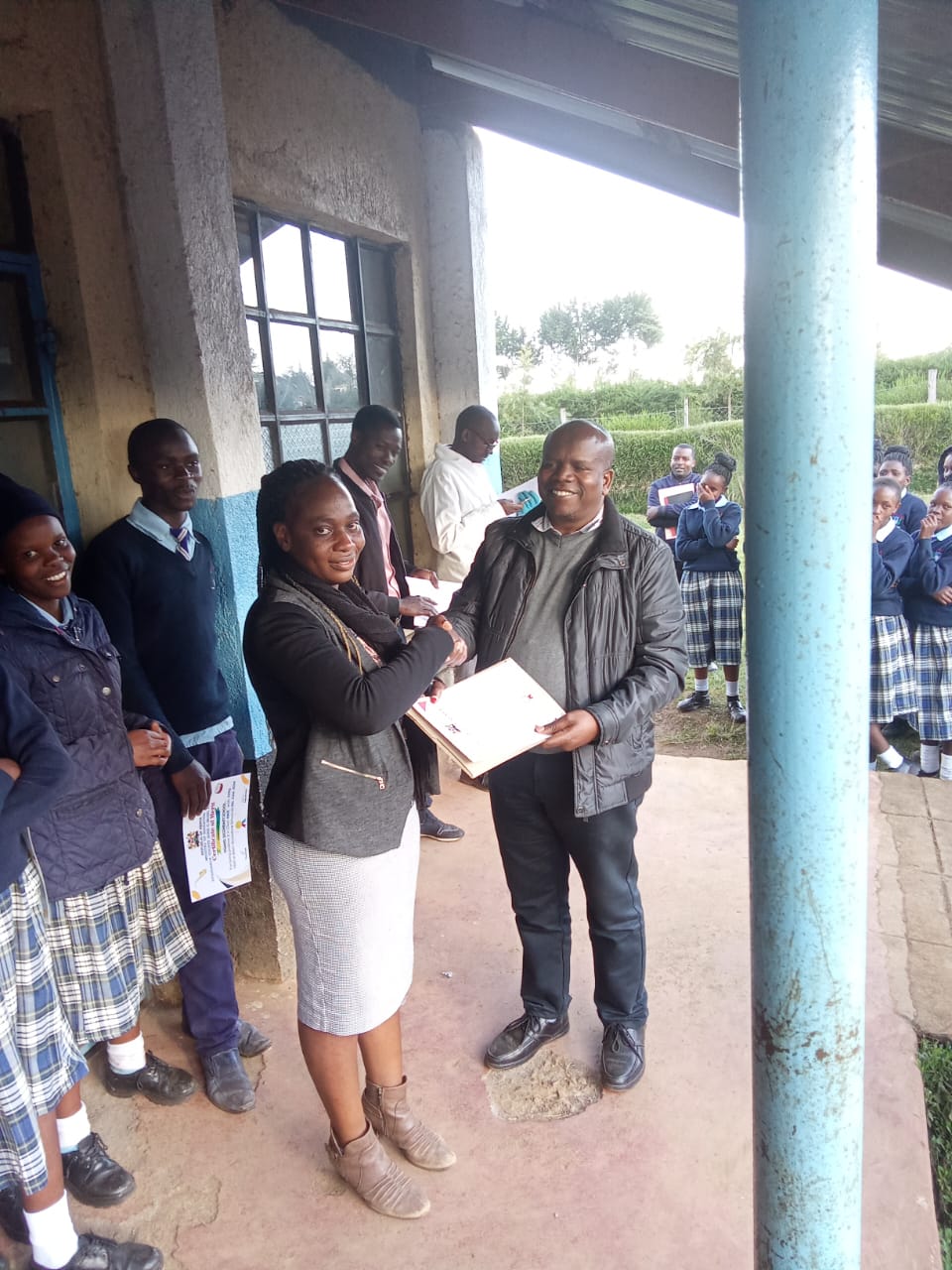 music department heads and students receiving certificates from the principal